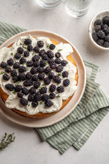 Fresh cakes with blackberries and cream cheese