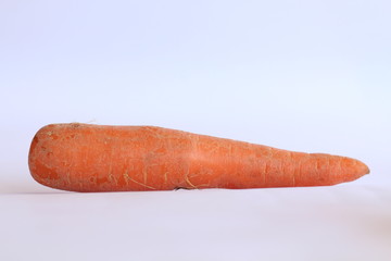 Long Juicy Crunchy Hairy Raw Carrot Isolated On White Background