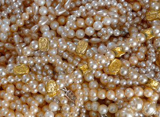 precious pearls top view closeup, shiny background