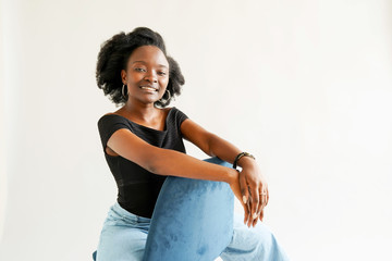 Portrait of young African American woman isolated over white background