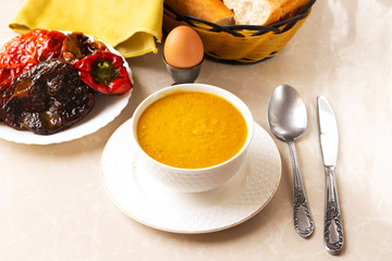 homemade arabic food lentil in bowl, bread and egg, fried red pepper