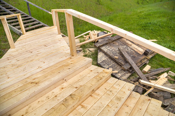 Fototapeta na wymiar New wooden stairs outdoors. Carpenters work.
