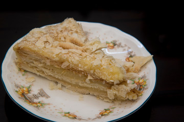 Napoleon cake on a fine ceramic plate