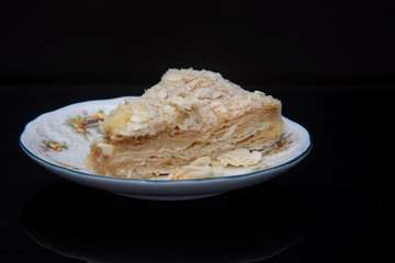 Napoleon cake on a fine ceramic plate