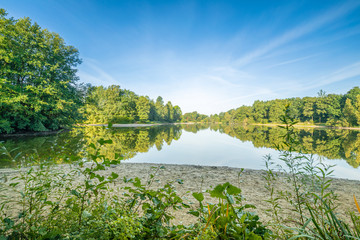 lake in lengerich with trees in the background
