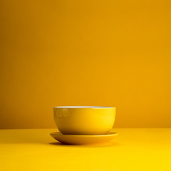 Still life of yellow cup