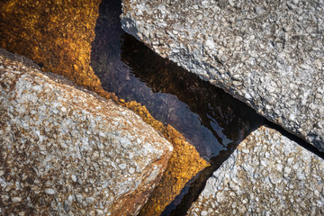 Geometric Rock Closeup at Lake's Edge - 290274951
