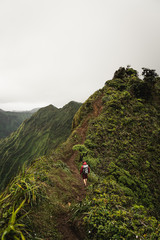 Dramatic views over Kaneohe hiking the Stairway to Heaven (Haiku Stairs) Oahu, Hawaii.