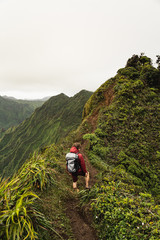 Dramatic views over Kaneohe hiking the Stairway to Heaven (Haiku Stairs) Oahu, Hawaii.