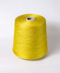 bobbin of yarn on a white background. Side view.Textile reel on isolated white background.