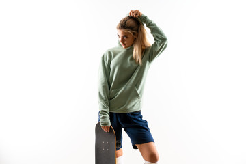 Naklejka premium Blonde teenager skater girl over isolated white background