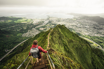 Dramatic views over Kaneohe hiking the Stairway to Heaven (Haiku Stairs) Oahu, Hawaii.