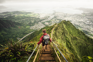 Dramatic views over Kaneohe hiking the Stairway to Heaven (Haiku Stairs) Oahu, Hawaii. - obrazy, fototapety, plakaty