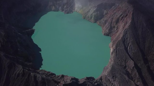 Aerial: Landscape view of Ijen volcano and lake. The most famous tourist attraction in Indonesia