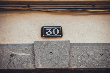 typical door sign with number 30