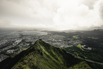Dramatic moody view of Kaneohe and Ho'omaluhia Botanical Gardenin Oahu, Hawaii. Taken on the Stairway to Heaven (Haiku Stairs) hike.