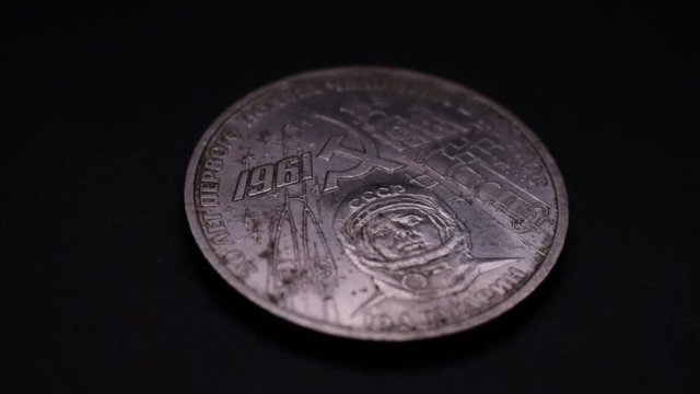 Old Soviet Rouble Coin Rotating On Black Background. Yuri Gagarin