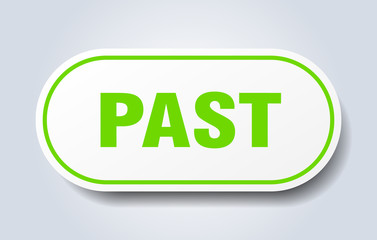 past sign. past rounded green sticker. past