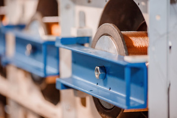 Production of copper wire, bronze cable in reels at factory