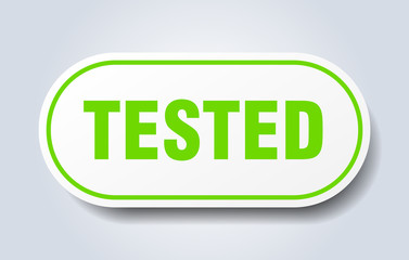 Fototapeta premium tested sign. tested rounded green sticker. tested