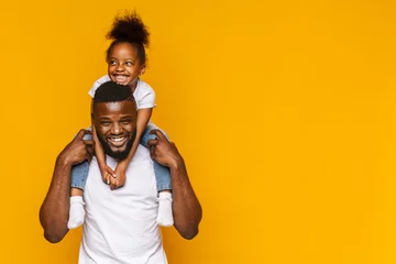 Foto op Plexiglas Happy african american father and daughter having fun © Prostock-studio