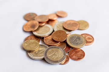 Various euro coins on white cloth. Money concept. Finance concept.