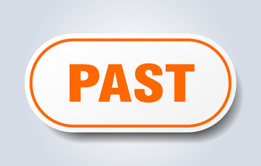 past sign. past rounded orange sticker. past