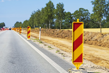 Warning signs along the road. Road reconstruction.
