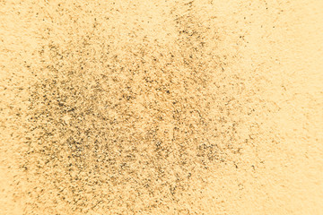 Beautiful closeup textures abstract colorful dark black white yellow tiles floor granite and bright gold wall pattern background and wallpaper.