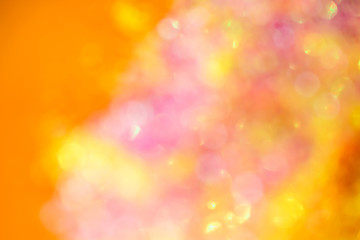Christmas festive blurred background - colorful sparkles close-up in a trendy neon light. Macro photo. Abstract bright image. The concept of holidays, parties.