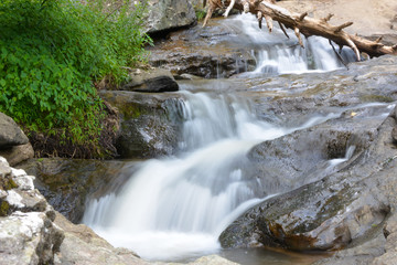 Naklejka na ściany i meble Water cascading over cunningham falls in the mountains of Maryland