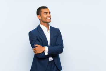 Businessman over isolated blue background