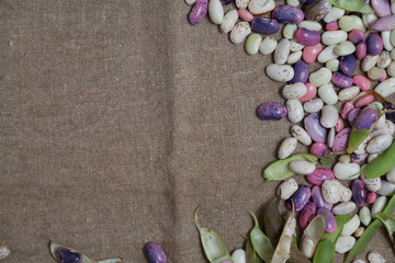 Obraz na płótnie Canvas Colorful beans lies on burlap