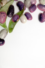 Multicolored beans on white background