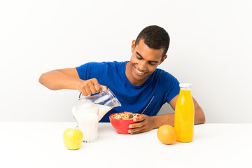 Young man having breakfast in a table