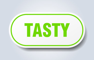 tasty sign. tasty rounded green sticker. tasty