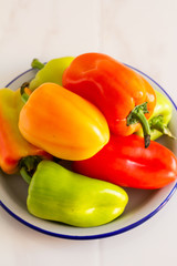 peppers on a plate on  a table