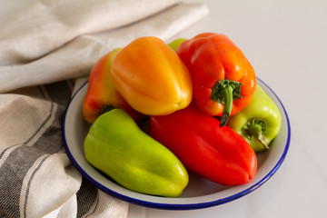 peppers on a plate on  a table