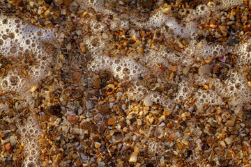 sea pebbles colored granite on the beach