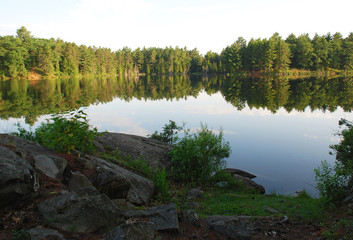 rocks on a calm lake shoreline