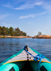 Kayaking at sea looking on coast. Ausflug mit Kajak vor Meeresküste.