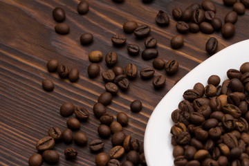 coffee beans on wooden background.