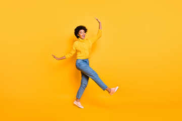 Fototapeta na wymiar Full length body size view of nice attractive cheerful cheery funky childish careless wavy-haired girl having fun free time isolated over bright vivid shine vibrant yellow color background