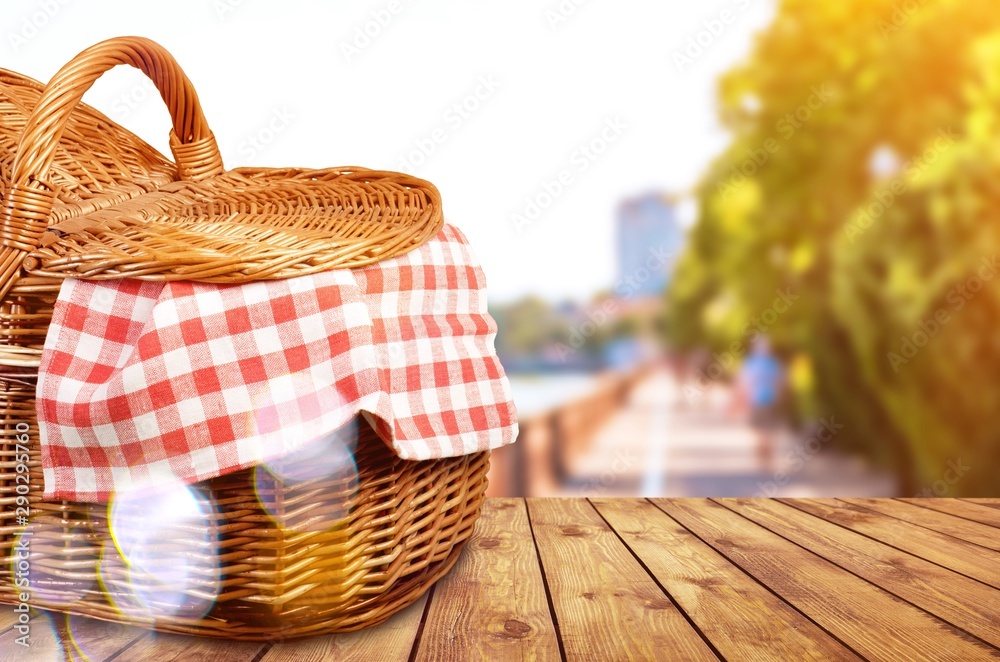 Poster Picnic Basket with napkin om nature background