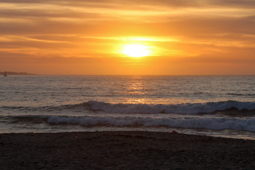 Obraz premium View of the sun about to set from Sand City Beach, California, USA