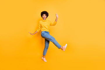 Fototapeta na wymiar Full length body size view of her she nice attractive cheerful cheery playful comic wavy-haired girl having fun free time fooling isolated on bright vivid shine vibrant yellow color background