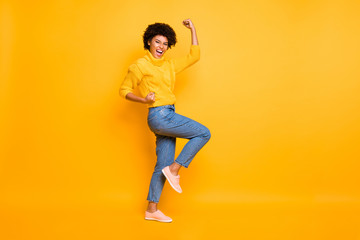 Fototapeta na wymiar Full length body size profile side view of her she nice attractive cheerful cheery ecstatic wavy-haired girl celebrating lucky day isolated on bright vivid shine vibrant yellow color background