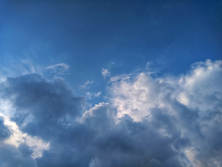 blue sky background with heavy clouds. sky only photo with heavy clouds in the half frame.