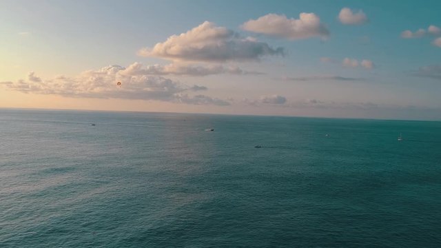 Parashute and motor boat in the ocean