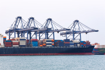 Fototapeta premium Industrial Container Cargo freight ship at habor for Logistic Import Export